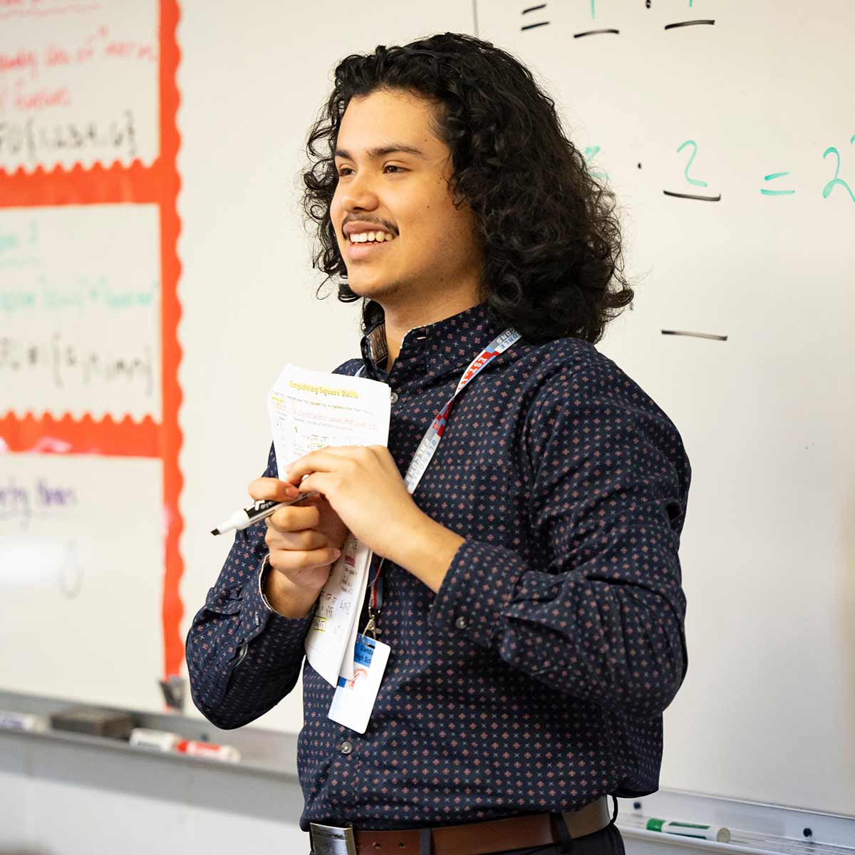 Student-teacher and math education major Joseeduardo Grandos Rodriguez teaches a high school class
