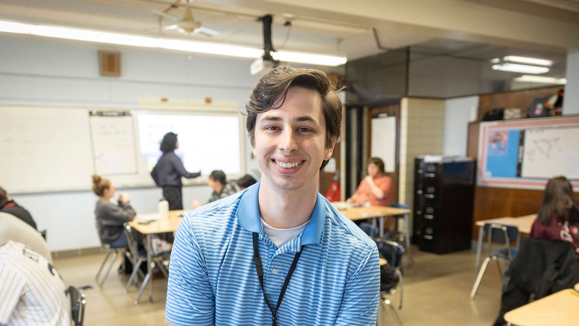 A high school math teacher in his classroom.