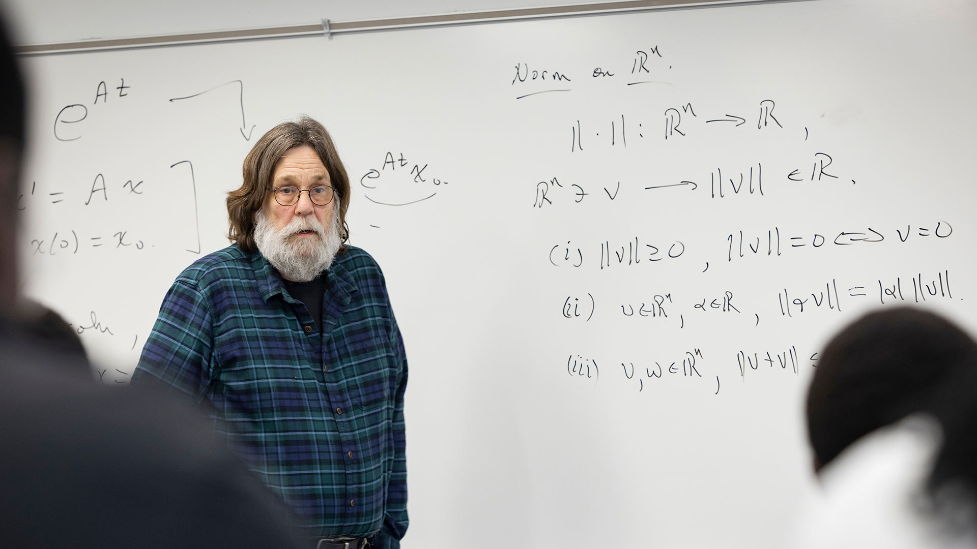 Math professor Dr. William Bray teaching a graduate-level class.